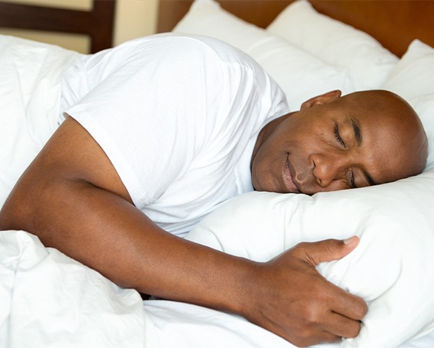 Man sleeping peacefully thanks to Fotona LightWalker NightLase treatment