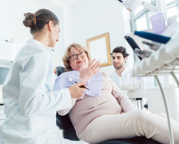 Patient talking to dentist during consultation