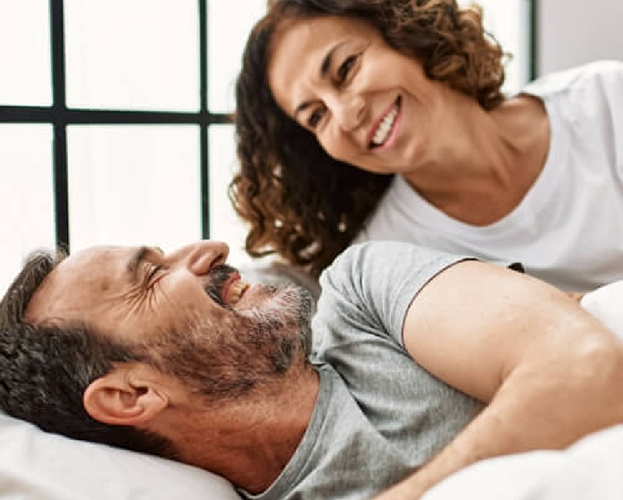 Young man snoring in bed